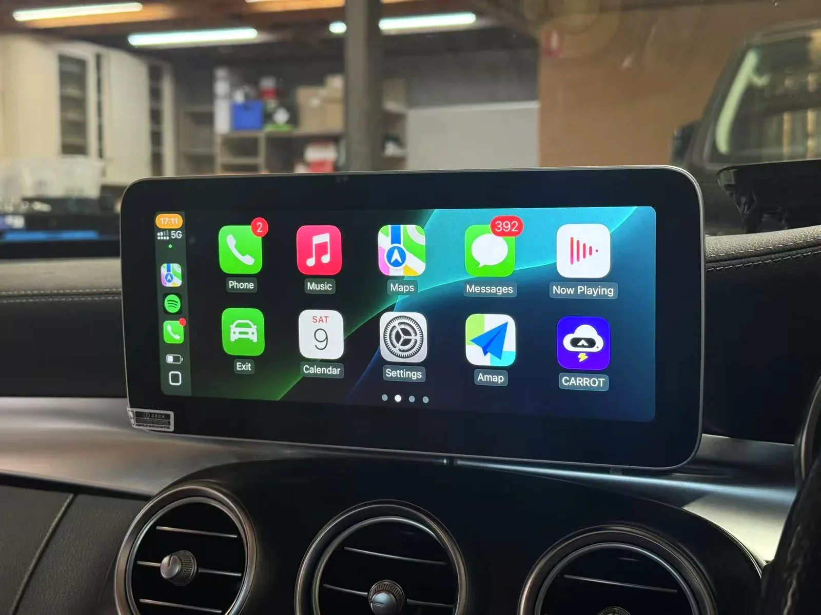 Apple CarPlay screen fitted in a Mercedes-Benz dashboard inside the C1 Automotive workshop