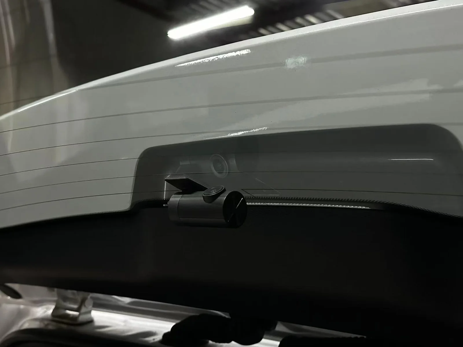 Rear dash cam mounted at the top of the rear windscreen on a Lexus LX
