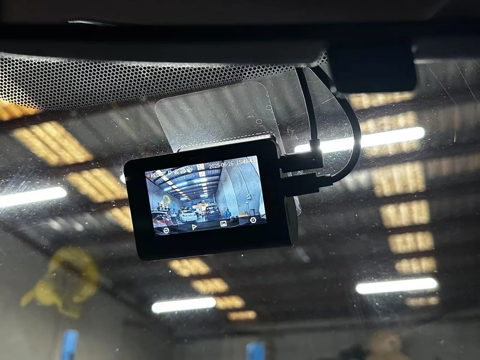 Front dash cam installed on a Toyota Yaris showing live recording screen