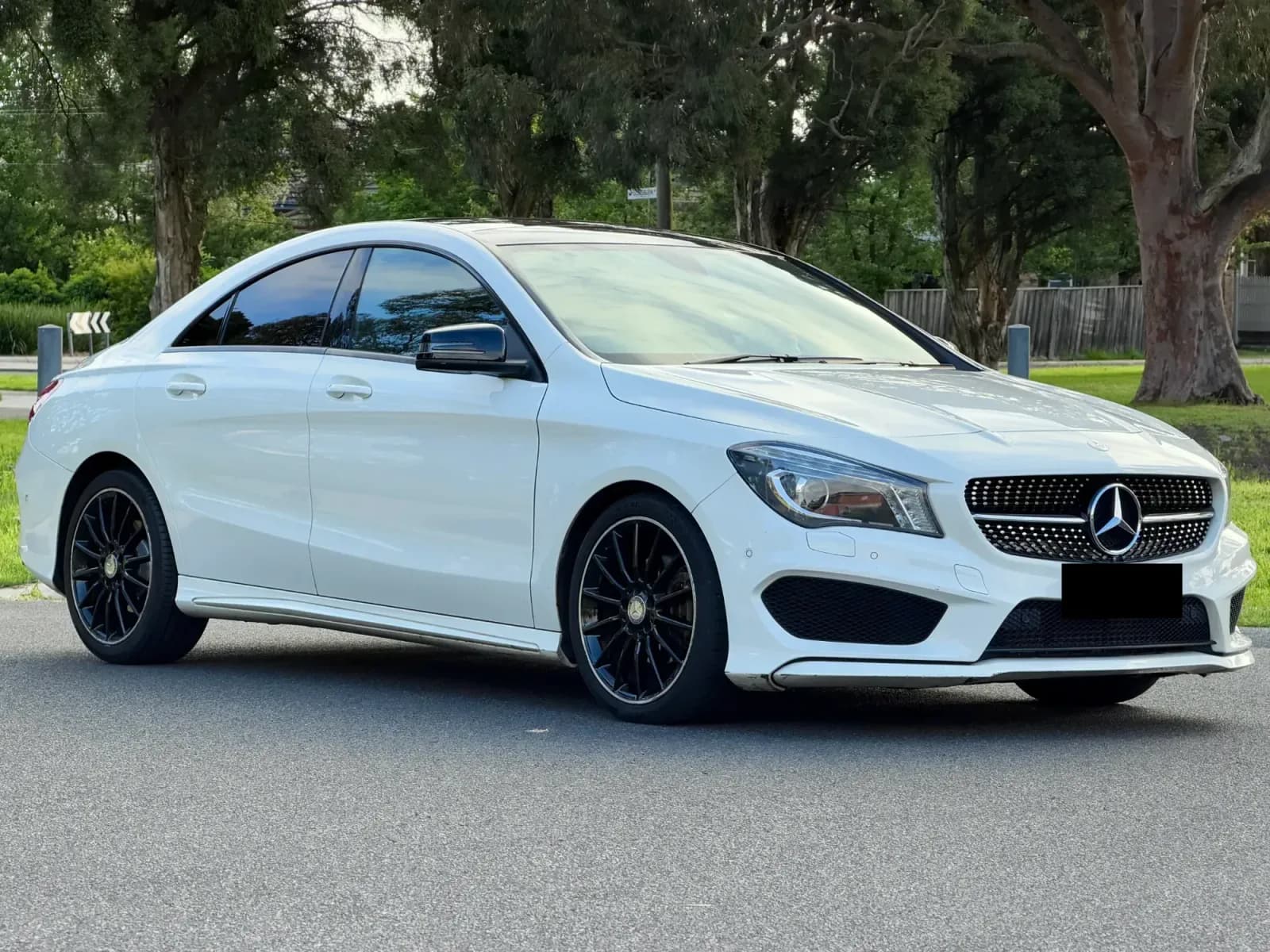 White 2015 Mercedes-Benz CLA with black wheels, number plate redacted