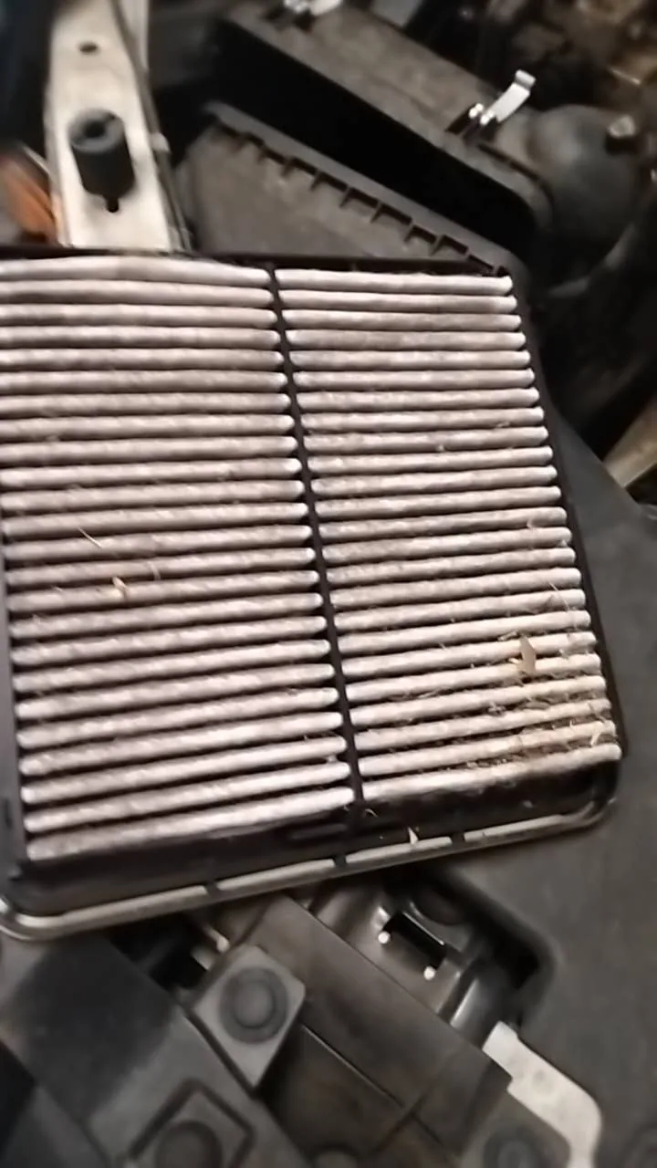 Used Subaru Forester engine air filter removed for a condition inspection during servicing