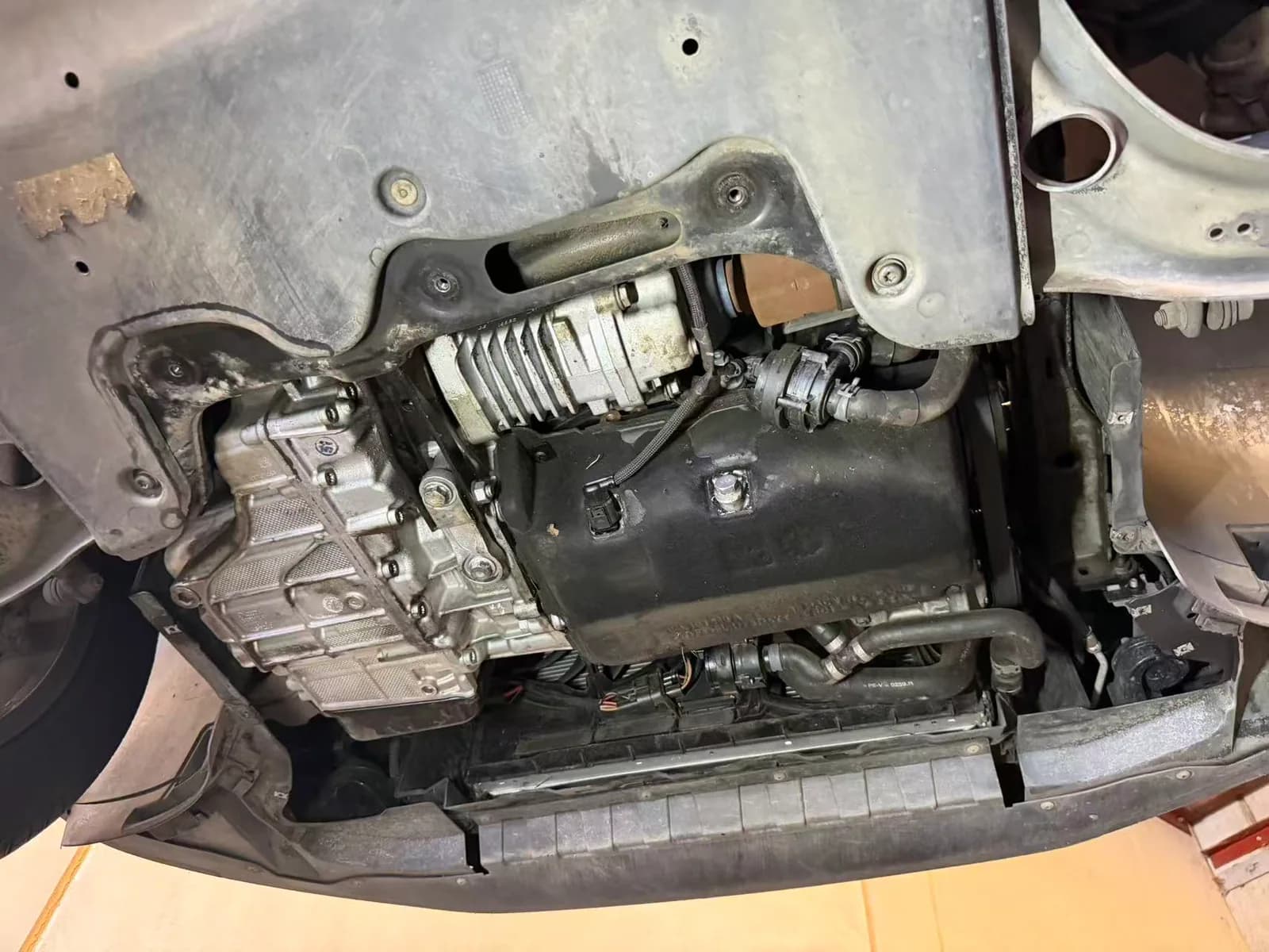 Volkswagen Tiguan engine and transmission underside being checked for visible leaks during a service at C1 Automotive in Oakleigh South